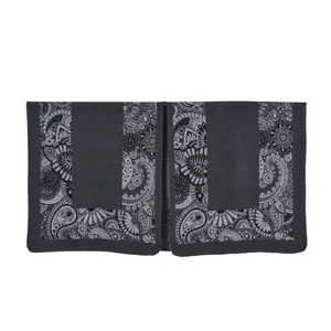 Detailed macro view of dark grey shawl with intricate paisley and floral embroidery