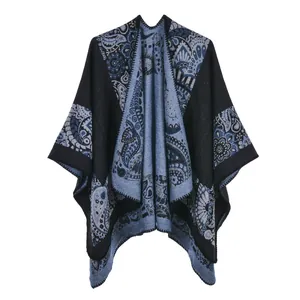 Detail of blue Paisley jacquard knit pattern on thick faux cashmere pashmina shawl