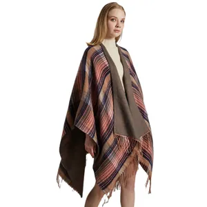 Classic plaid shawl wrap with pink and blue tartan pattern and soft fringe edges