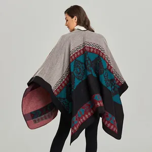 Detailed back view of women's thick knit shawl with bohemian geometric patterns