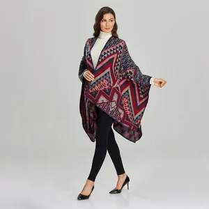 Detail of knit shawl featuring geometric pattern and fine stitched edges in studio