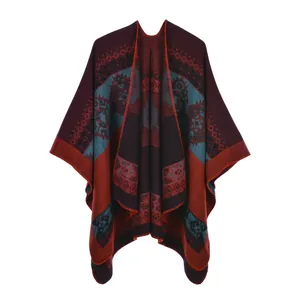 Detail view of ethnic geometric pattern and fine stitching on the vintage poncho