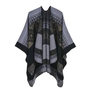 Detail of grey and black ethnic geometric knit patterns on a soft cashmere shawl