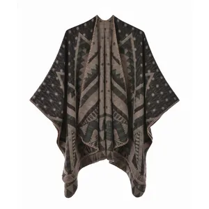 Detail of knit fabric edge and geometric pattern on retro split shawl cape blanket