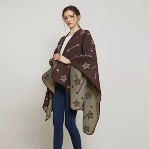 Close-up of jacquard knit shawl featuring brown star patterns and fine hem detail