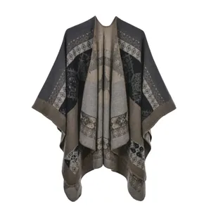 Detail of bohemian knit shawl with geometric diamond patterns and lock-stitched edges