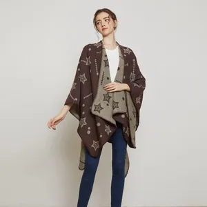 Detail of knitted women's poncho with jacquard star pattern and open front design