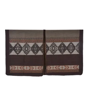 Detail of ethnic geometric patterns and woven texture on a brown poncho shawl scarf