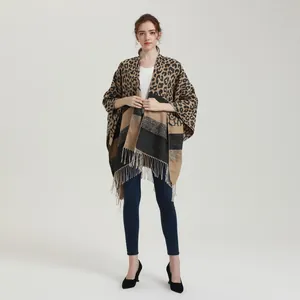 Fashionable women's leopard print shawl with fringe details and split poncho design