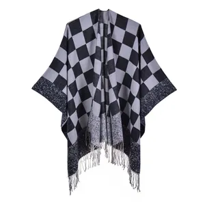 Classic black and gray plaid knit shawl cape with fringe hem and open front style