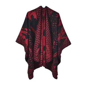 Close-up of the thick knit texture and marble pattern on the red and black shawl
