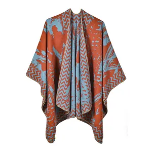 Thick bohemian knit shawl in rust red and grey blue geometric pattern for winter wrap