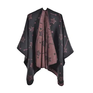 Detail of knitted women's shawl featuring star pattern and dual-tone reversible fabric