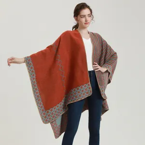 Women's knit shawl poncho with rust red and grey stripes and bohemian patterns