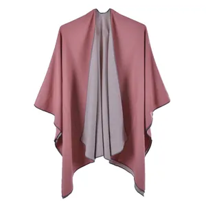 Close-up of pink and grey double-sided shawl with fine knit texture and neat edge binding
