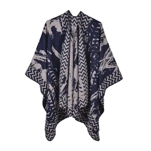 Detail of knitted cape showing blue and white marble texture and wavy herringbone edges