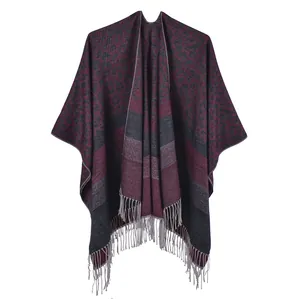 Detailed close-up of dark red leopard print scarf with tassels and fringe texture