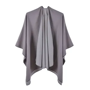 Detail of gray reversible shawl showing soft double-sided fabric texture and hem stitching