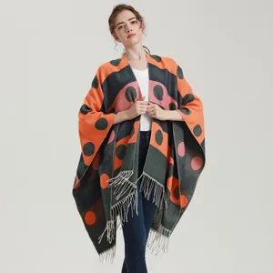 Knit shawl wrap with bold geometric polka dots and tassel hem for autumn and winter wear