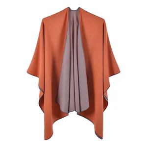 Detail of high-quality double-sided knit shawl showing neat hem and soft fiber texture