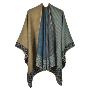 Detail of knit shawl featuring yellow and blue stripes with geometric diamond pattern