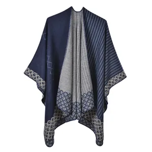 Detailed view of the thick knit texture and geometric diamond hem on this winter shawl