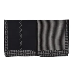 Detail shot of the black and gray striped pattern and diamond edge piping on the scarf