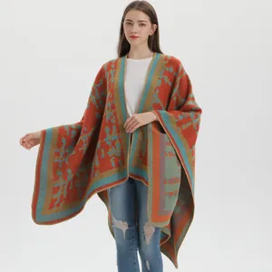 Close-up of bohemian geometric knit shawl with colorful patterns and decorative stitching