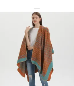 Close-up of geometric jacquard pattern and edge stitching on bohemian knit poncho
