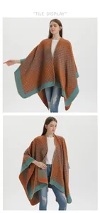 Close-up detail of geometric diamond pattern and stitching on orange knit poncho
