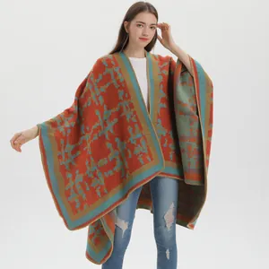 Cozy orange and blue-green geometric knit shawl cape for women in autumn and winter