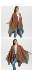 Detail of women's orange geometric knit shawl cape with vibrant teal trim detail