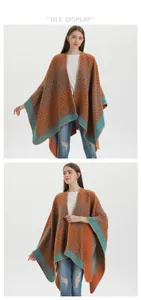 Detail of vintage geometric jacquard knit poncho wrap for women with contrast trim