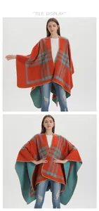 Detail of soft knit split poncho with orange and teal green classic plaid pattern