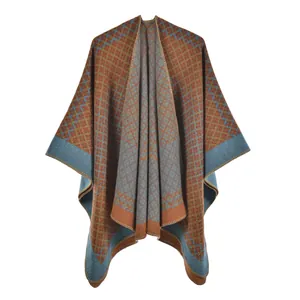 Close-up of geometric diamond pattern knit shawl showing fine jacquard texture and trim