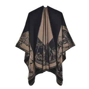 Detail of retro vintage print pattern on black and khaki knitted shawl cape for travel
