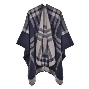 Close-up showing the deep blue and grey checkered weave with herringbone texture on the shawl