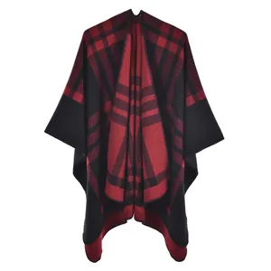 Close-up of red and black tartan plaid thick cashmere-like poncho shawl for women