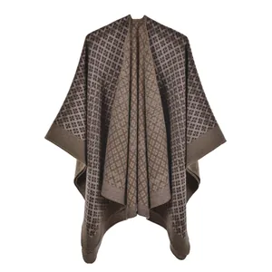 Macro detail of the high-density knit fabric and geometric pattern on this autumn shawl