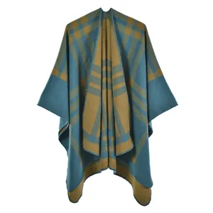 Detailed view of peacock blue and mustard yellow plaid cashmere shawl with stitched edges