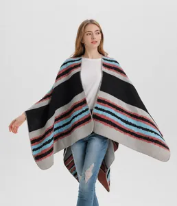 Close-up of the striped knit shawl showing fine overlock edge and premium texture