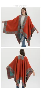 Front and back view of a thick ethnic knit poncho in brick red with teal geometric patterns