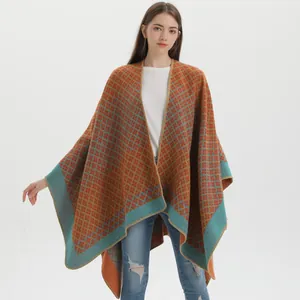 Women's warm geometric diamond knit shawl cape poncho in orange and teal colors
