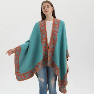 Lake blue ethnic knit poncho shawl with orange-red geometric patterns and embroidery