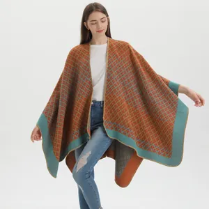 Detail of bohemian geometric plaid pattern and fine stitching on the knit shawl wrap