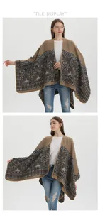 Detail of bohemian brown knit shawl with exquisite black floral embroidery patterns