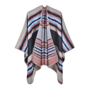 Detail of bohemian knit shawl with wave pattern and meticulous edge stitching finish
