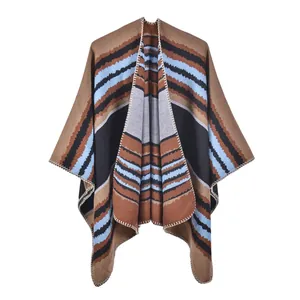 Detail of knitted winter shawl with brown and blue wave patterns and edge stitching