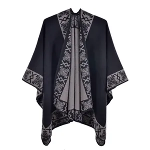 Close-up of knit fabric texture and floral jacquard pattern on the black shawl