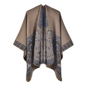Detail of vintage floral jacquard pattern on a thick knit warm pashmina shawl